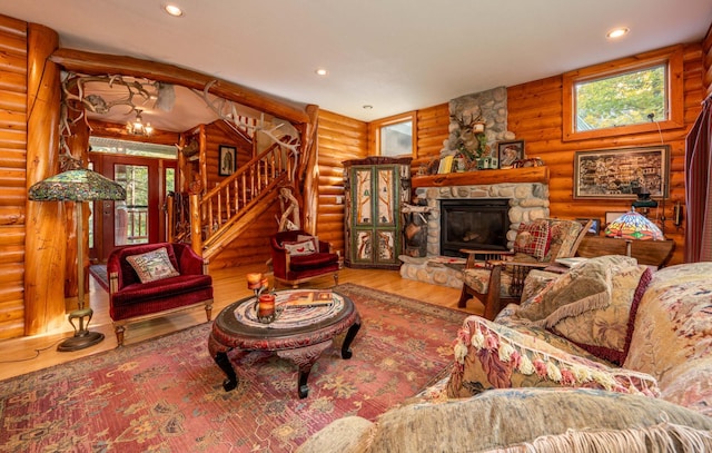51641 Edgewater Rd, Spring Lake, MN 56680 - living room featuring rustic walls, wood finished floors, healthy amount of natural light, stairway, and recessed lighting