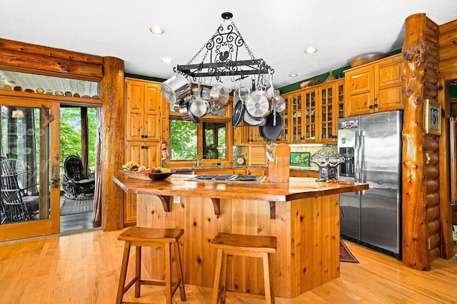 51641 Edgewater Rd, Spring Lake, MN 56680 - kitchen with stainless steel appliances, wooden counters, light wood-style flooring, glass insert cabinets, and recessed lighting