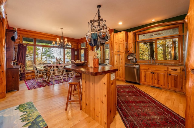 51641 Edgewater Rd, Spring Lake, MN 56680 - kitchen with dishwasher, a chandelier, light wood finished floors, butcher block countertops, and hanging light fixtures