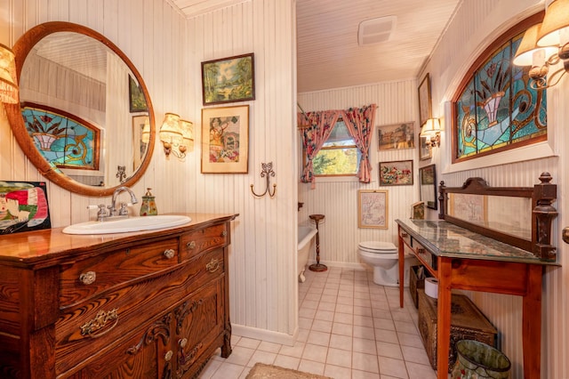 51641 Edgewater Rd, Spring Lake, MN 56680 - bathroom with toilet, tile patterned floors, baseboards, a tub, and vanity