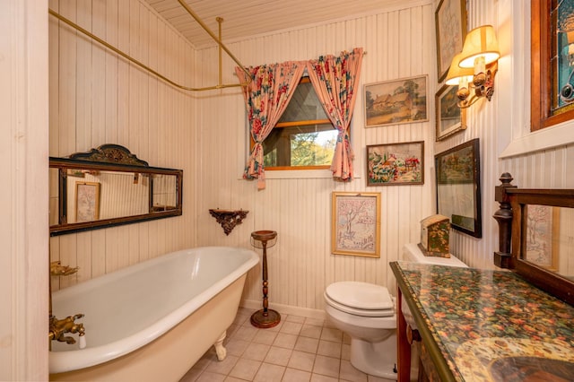 51641 Edgewater Rd, Spring Lake, MN 56680 - bathroom with vanity, a freestanding tub, toilet, tile patterned flooring, and baseboards