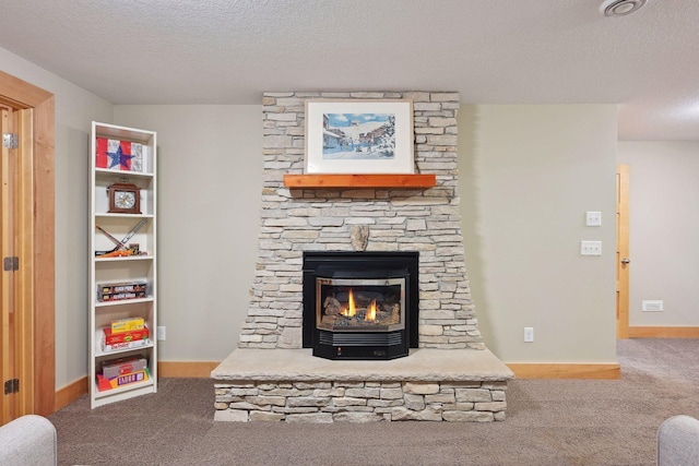 carpeted living room featuring a textured ceiling, a stone fireplace, and baseboards
