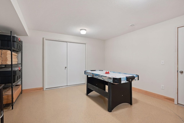 rec room featuring baseboards