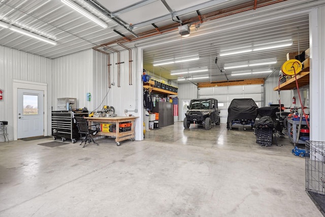 garage featuring a workshop area and a garage door opener