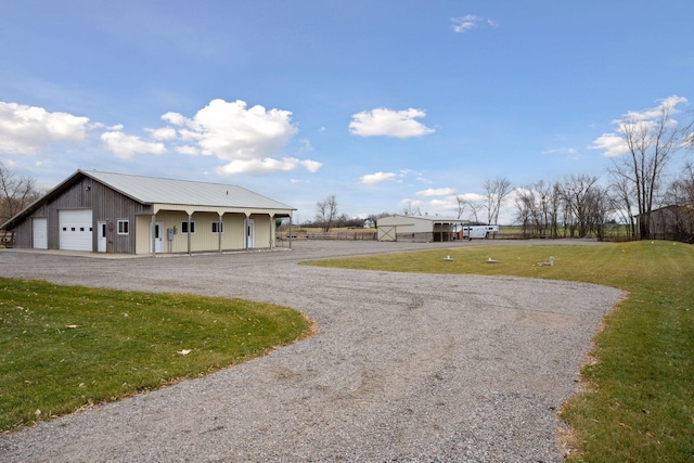 exterior space with gravel driveway
