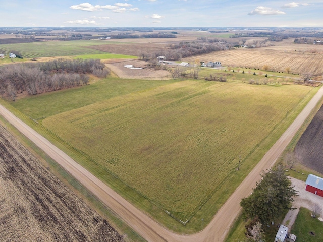 birds eye view of property with a rural view