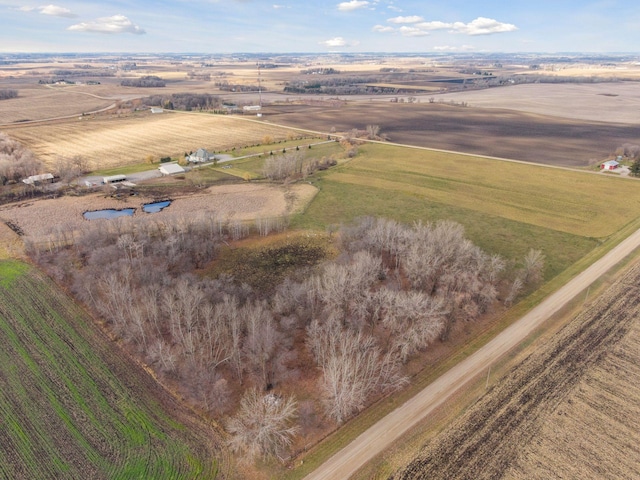birds eye view of property with a rural view