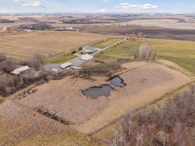 birds eye view of property with a rural view
