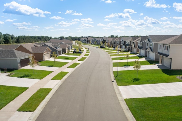 view of road with a residential view, sidewalks, and curbs