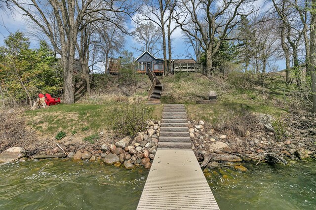 view of dock with stairs and a water view