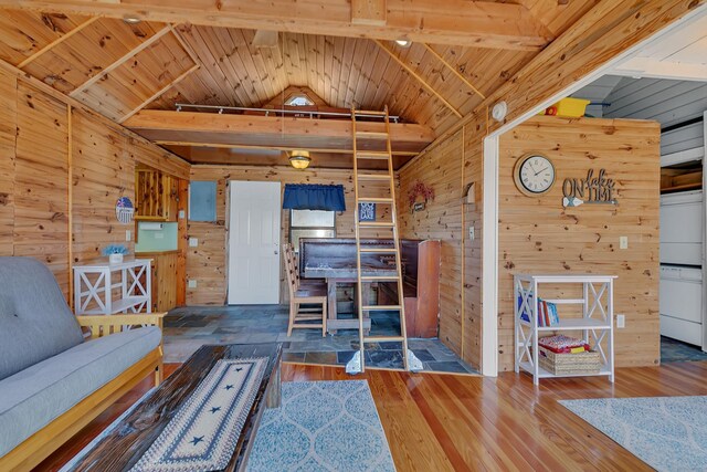 unfurnished living room featuring wood finished floors, lofted ceiling, wooden walls, and wooden ceiling
