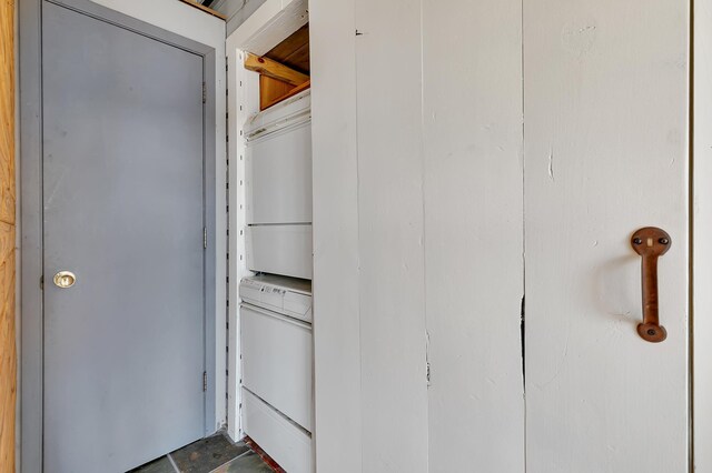 interior space with stacked washer / drying machine