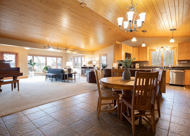 dining space featuring vaulted ceiling, a chandelier, stone tile flooring, wooden ceiling, and dark colored carpet