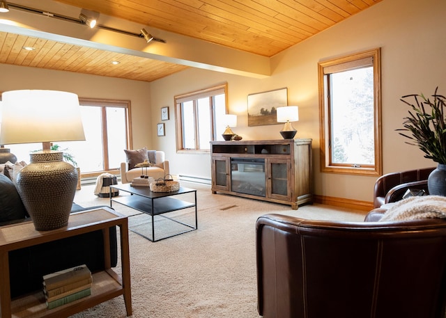 carpeted living room featuring a baseboard heating unit, wooden ceiling, baseboards, and rail lighting