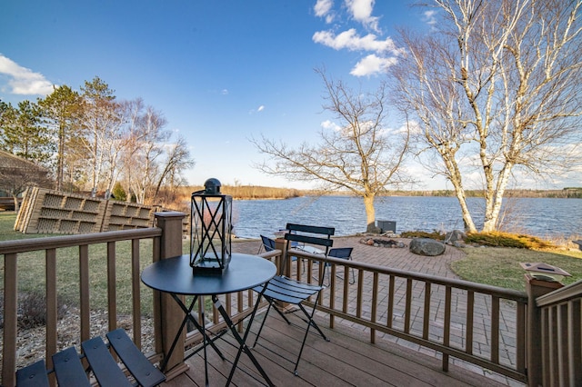 wooden deck with a water view