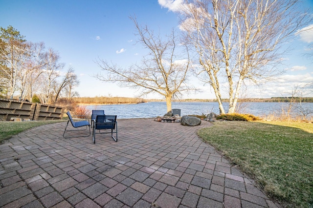 view of patio featuring a water view