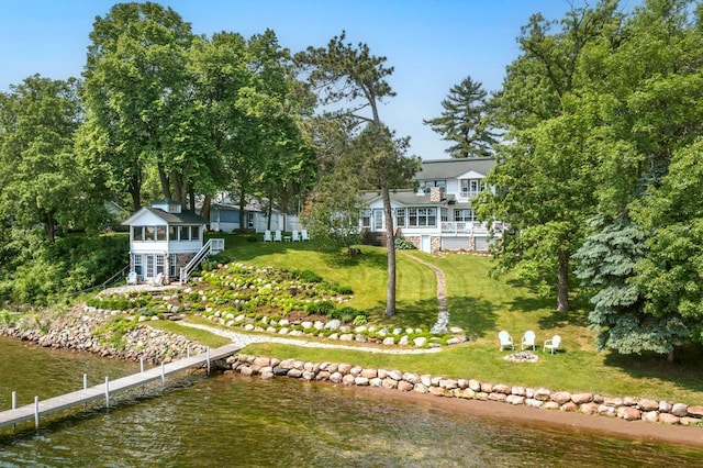 9472 Rocky Point Trl, Lake Shore, MN 56468 - back of property with a water view, a yard, and a fire pit