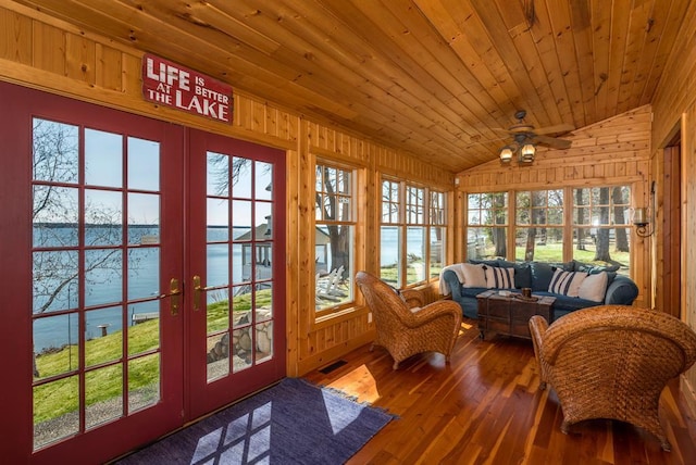 9472 Rocky Point Trl, Lake Shore, MN 56468 - sunroom / solarium with french doors, a water view, lofted ceiling, wooden walls, and hardwood / wood-style floors