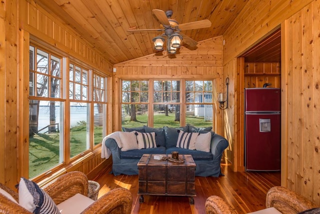 9472 Rocky Point Trl, Lake Shore, MN 56468 - sunroom featuring wood walls, lofted ceiling, wooden ceiling, healthy amount of natural light, and hardwood / wood-style flooring