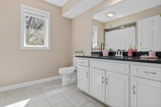 1337 Kenilworth Dr, Woodbury, MN 55125 - bathroom featuring tile patterned flooring, vanity, toilet, baseboards, and curtained shower