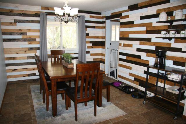21 Main St, Luck, WI 54853 - dining space with a chandelier and wooden walls