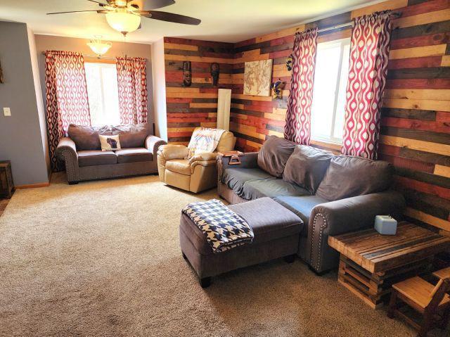 21 Main St, Luck, WI 54853 - carpeted living area featuring plenty of natural light and a ceiling fan