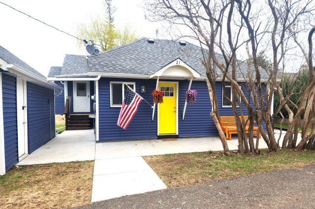 21 Main St, Luck, WI 54853 - bungalow featuring entry steps and roof with shingles
