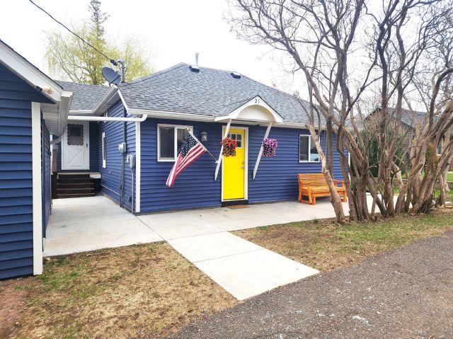 21 Main St, Luck, WI 54853 - bungalow-style house with entry steps and roof with shingles