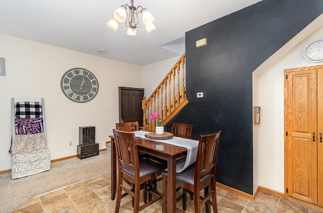 dining room featuring baseboards, a notable chandelier, light colored carpet, stone finish flooring, and stairs