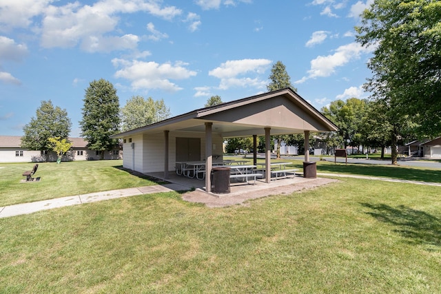 surrounding community featuring a lawn and a patio