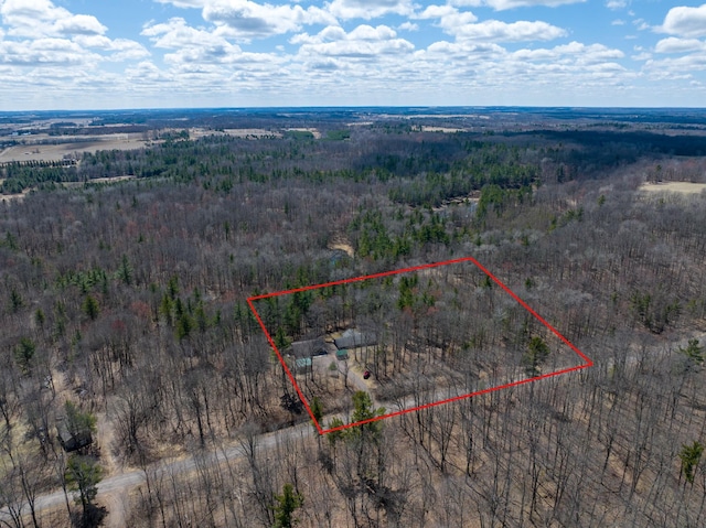 birds eye view of property with a wooded view