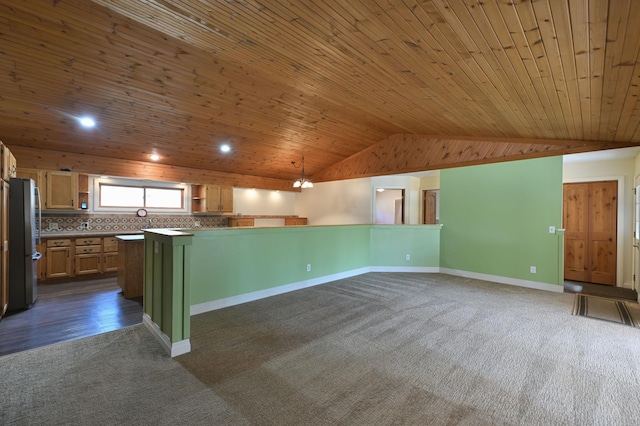 kitchen featuring dark colored carpet, baseboards, wood ceiling, freestanding refrigerator, and lofted ceiling