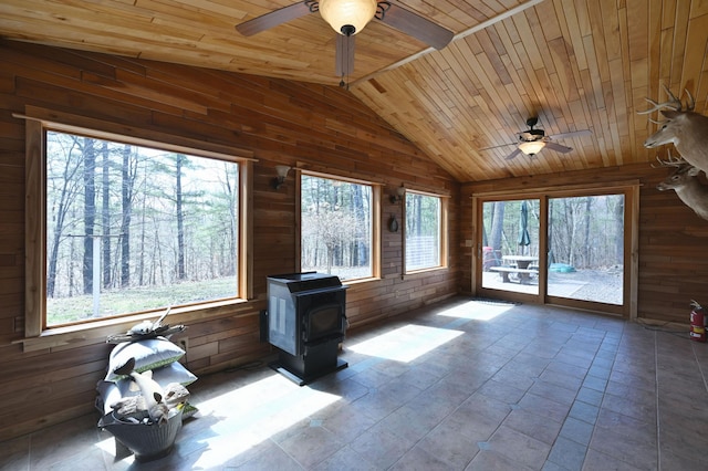 unfurnished sunroom with a wood stove