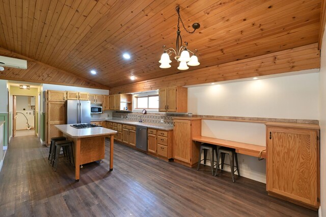 kitchen with a breakfast bar, appliances with stainless steel finishes, lofted ceiling, and wood ceiling