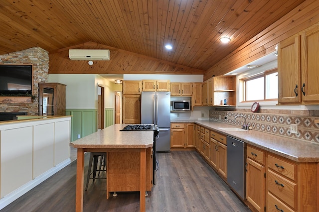 kitchen with open shelves, a center island, an AC wall unit, appliances with stainless steel finishes, and lofted ceiling