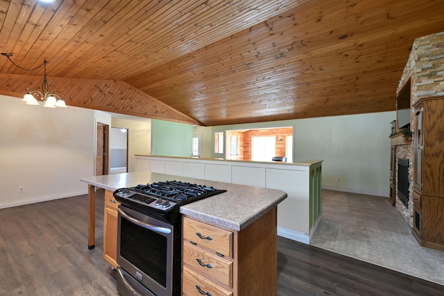 kitchen featuring a center island, vaulted ceiling, gas range, and wood ceiling