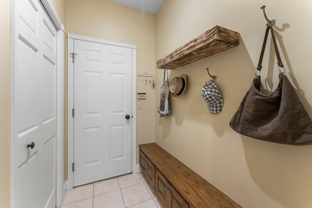 mudroom with light tile patterned floors