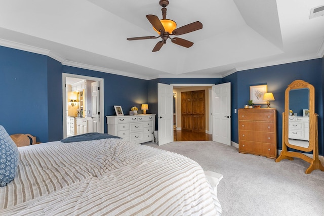 carpeted bedroom featuring crown molding, a raised ceiling, a ceiling fan, baseboards, and visible vents