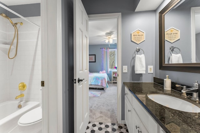 ensuite bathroom featuring vanity, toilet, ensuite bathroom, ceiling fan, and shower / bath combination
