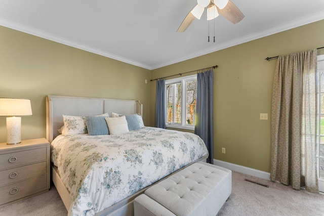 bedroom featuring ceiling fan, visible vents, light colored carpet, baseboards, and ornamental molding