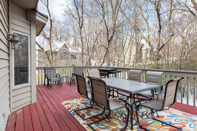 wooden deck with outdoor dining space
