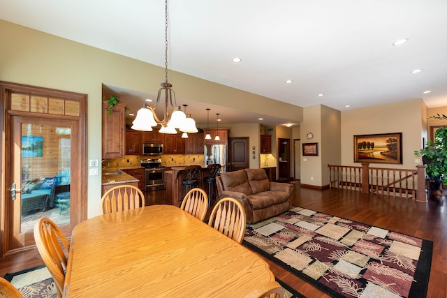 105 Viking Ct, Mankato, MN 56001 - dining space with recessed lighting, a chandelier, wood finished floors, and baseboards