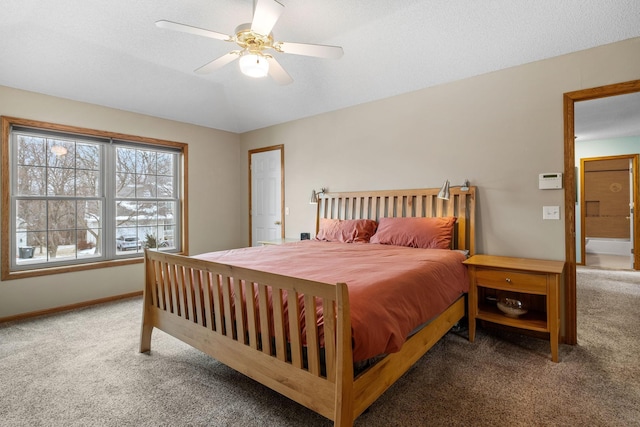 carpeted bedroom featuring ceiling fan and baseboards