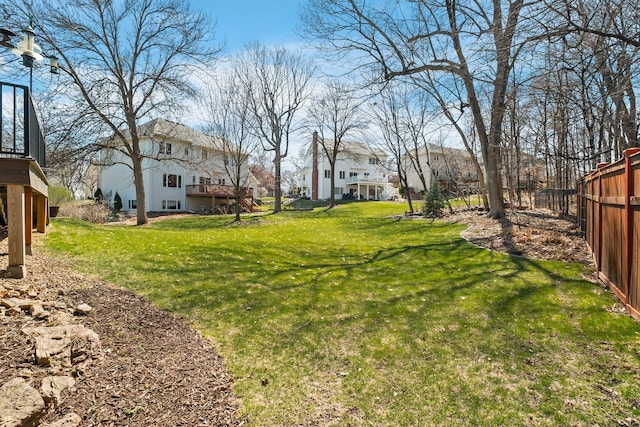 view of yard with a residential view and a deck