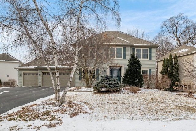 view of front of house featuring an attached garage and driveway