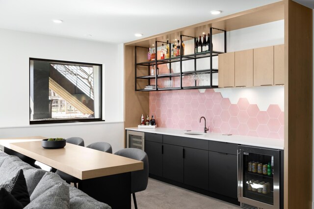 3701 Upton Ave S, Minneapolis, MN 55410 - bar featuring indoor wet bar, tasteful backsplash, a sink, and wine cooler