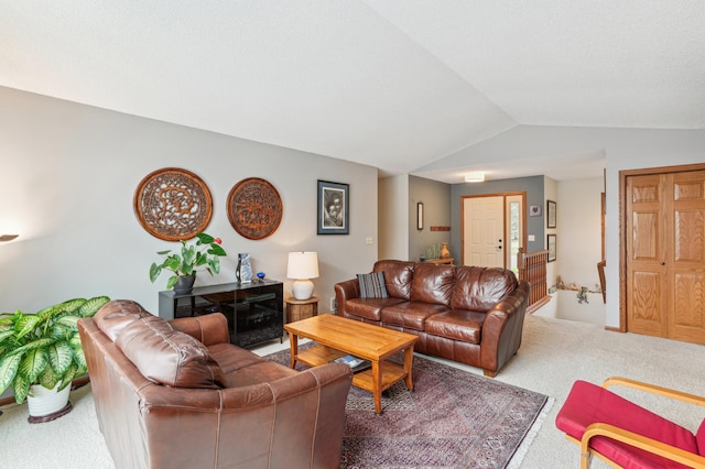 living room with carpet and vaulted ceiling