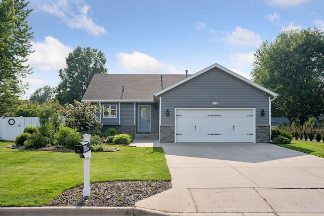11 6th Ave S, Sartell, MN 56377 - ranch-style home with an attached garage, stone siding, concrete driveway, and a shingled roof