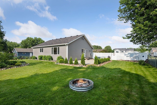 11 6th Ave S, Sartell, MN 56377 - back of property featuring a patio, a fenced backyard, and an outdoor fire pit