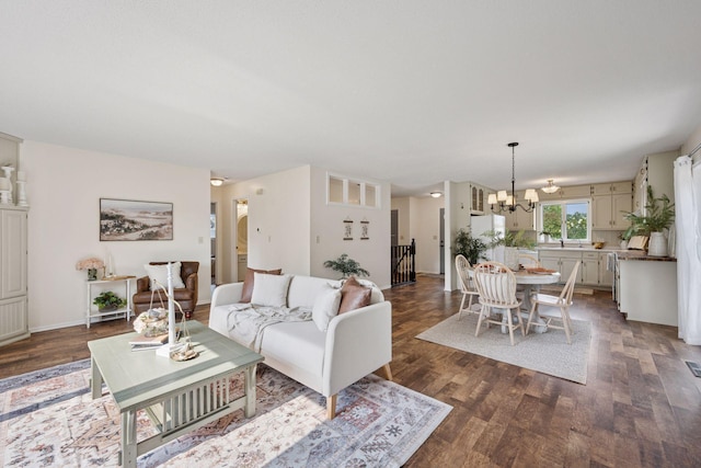 11 6th Ave S, Sartell, MN 56377 - living room featuring dark wood-type flooring and a chandelier
